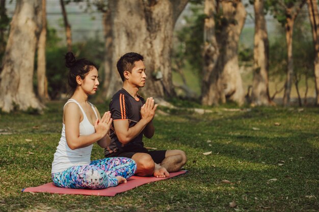 Young couple doing yoga