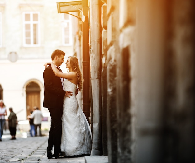 Free Photo young couple embracing on the street