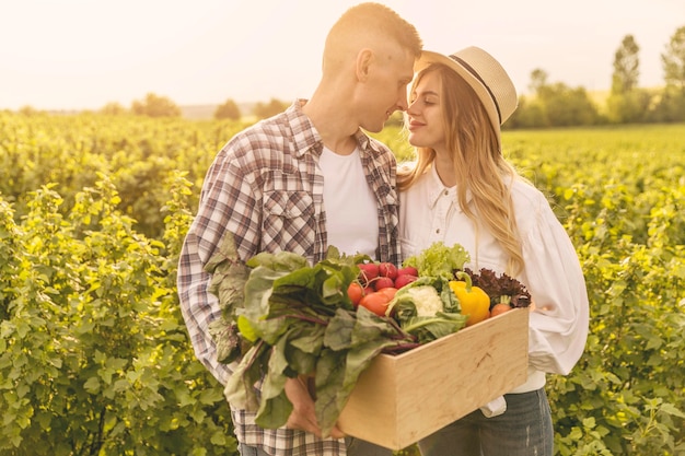 Free photo young couple at farm