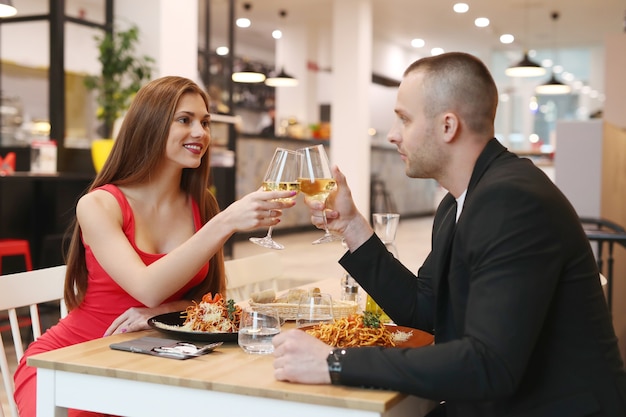 Young couple having dinner at the restaurant