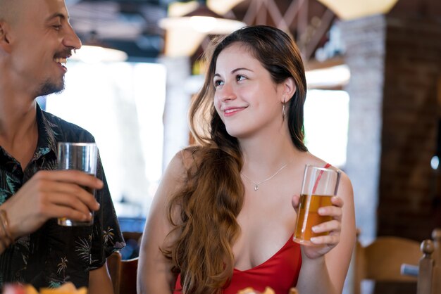 Young couple having lunch together at a restaurant.