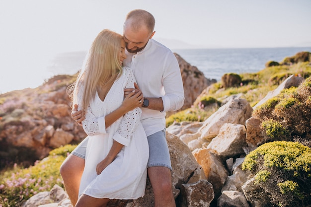 Free photo young couple on honeymoon in greece by the sea