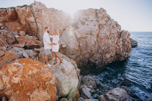 Young couple on honeymoon in Greece by the sea