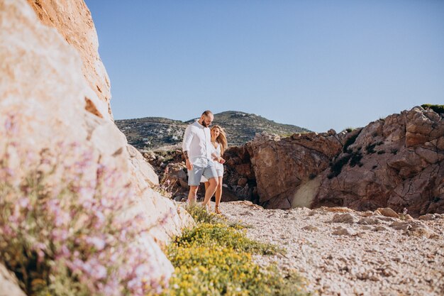 Young couple on honeymoon in Greece by the sea