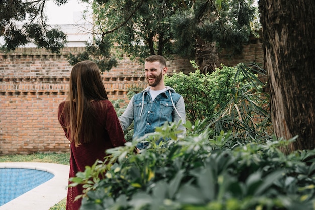 Free photo young couple in love in garden