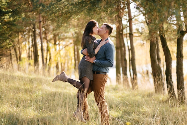 Young couple in love. A love story in the autumn forest park