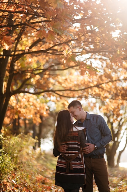 Young couple in love. A love story in the autumn forest park