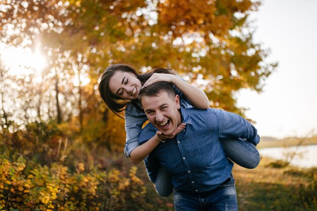 Young couple in love. A love story in the autumn forest park