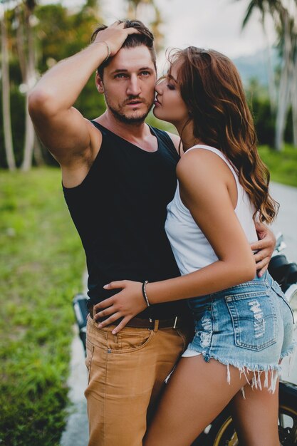 Young couple in love near motorcycle