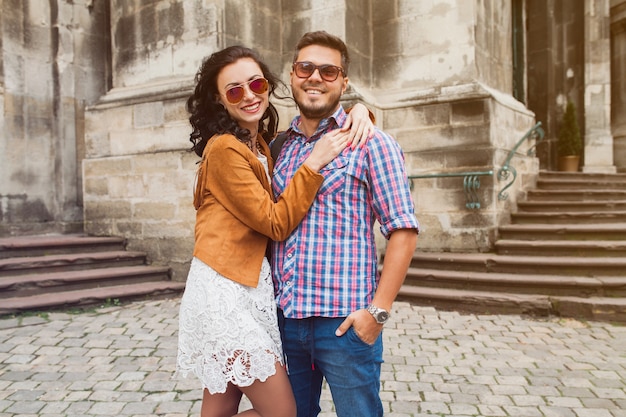 Young couple in love posing in old town