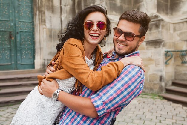 Young couple in love posing in old town