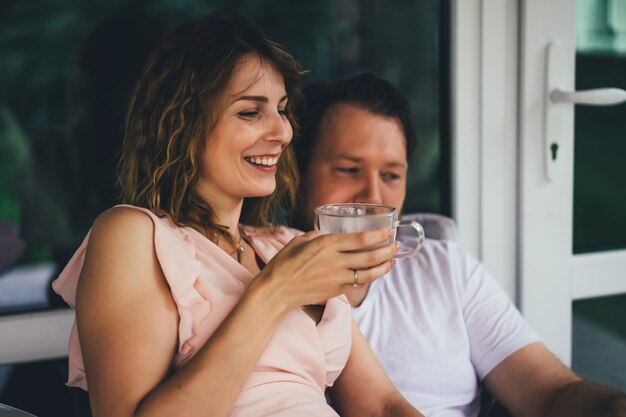 Young couple in love on the terrace of their home.