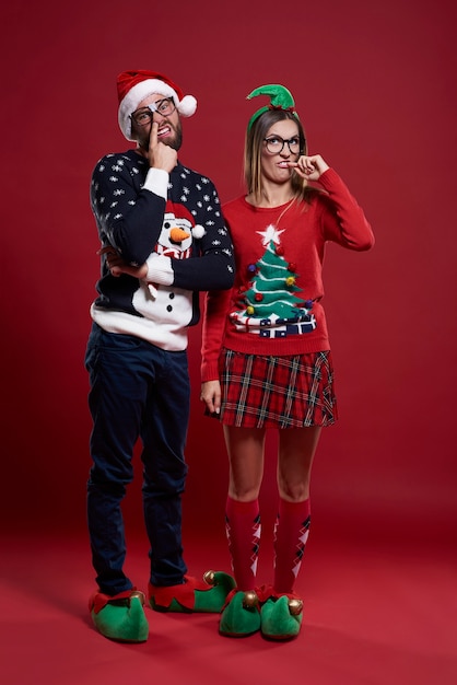 Young couple making funny faces isolated