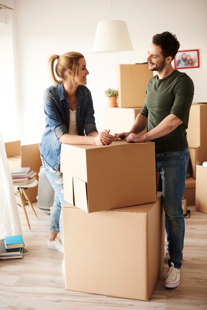 Young couple moving in to a house