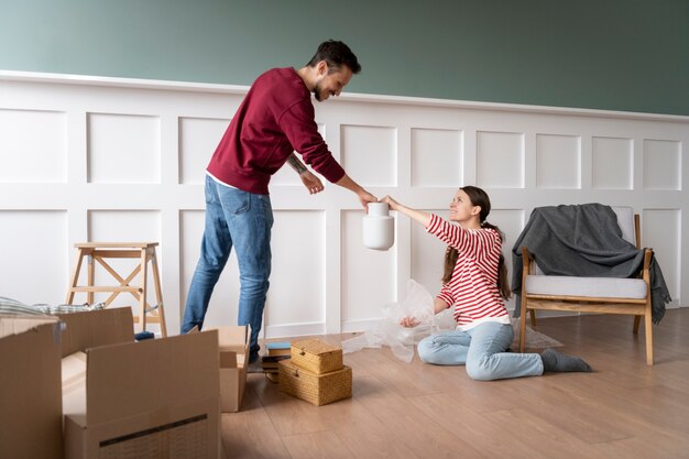 Young couple moving into a new home