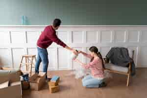 Free photo young couple moving into a new home