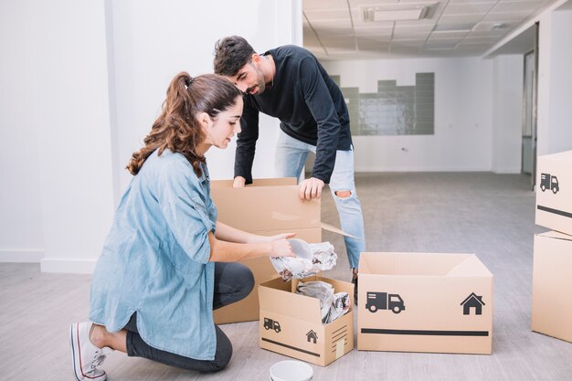 Young couple moving to new flat