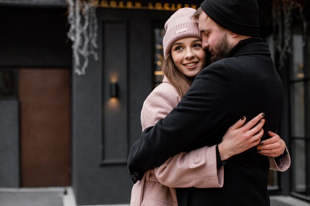 Young couple outdoor hugging