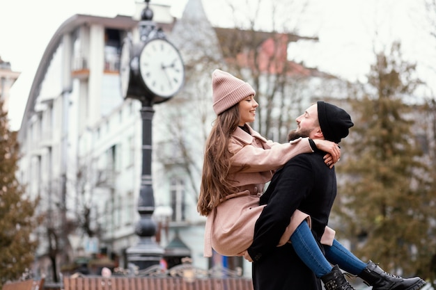 Free Photo young couple piggy back ride