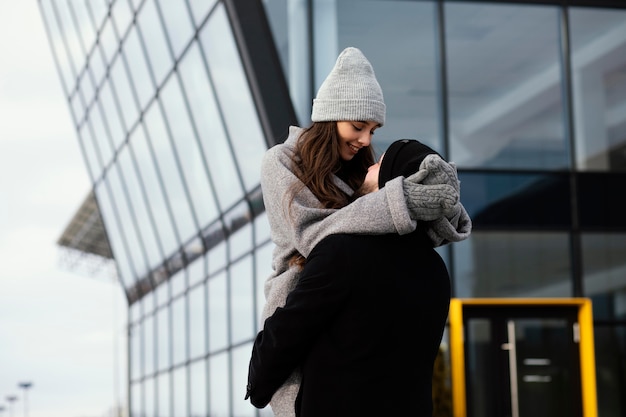 Young couple piggy back ride