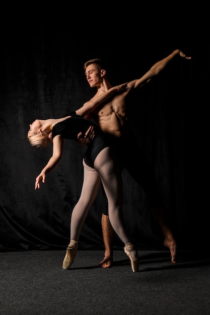 Young couple posing in ballet outfits