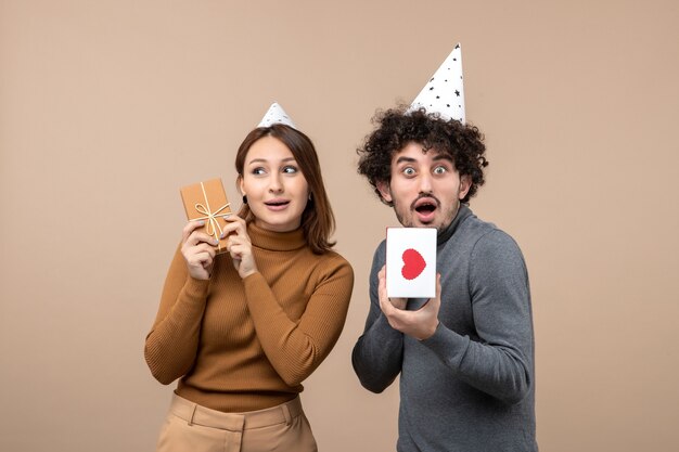 A young couple posing in the studio