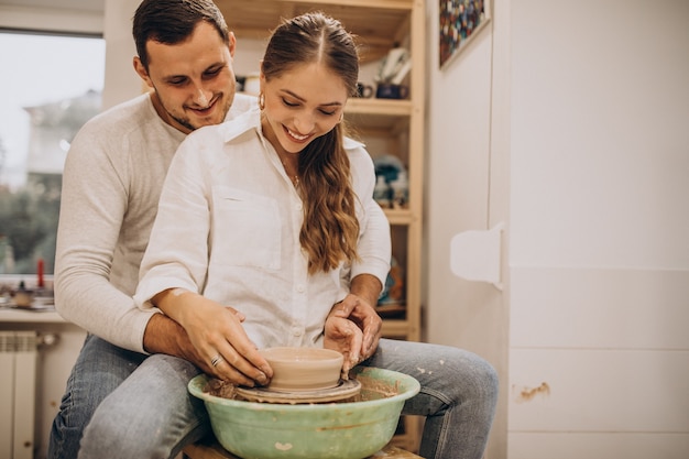 Free Photo young couple at a pottery class together