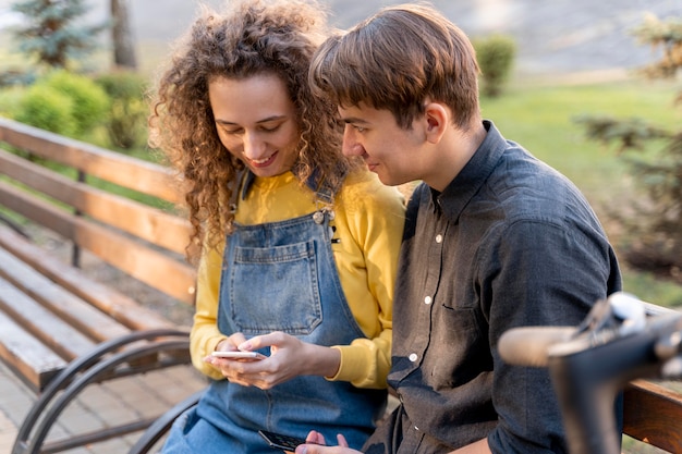 Free Photo young couple relaxing together outdoors