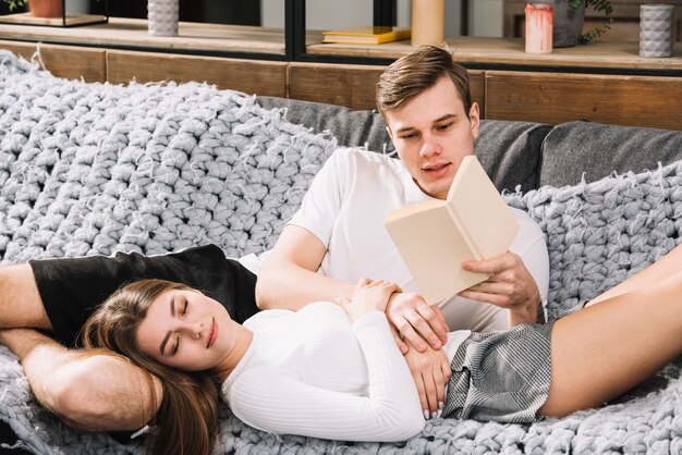 Young couple resting on couch 