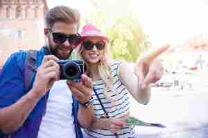 Free photo young couple sightseeing old town