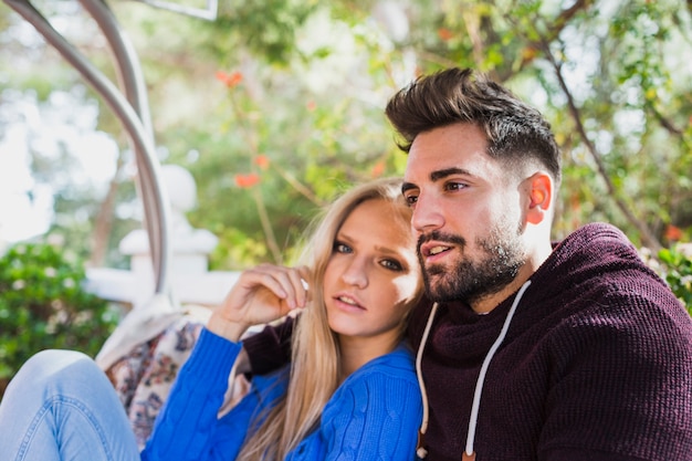 Young couple sitting outside