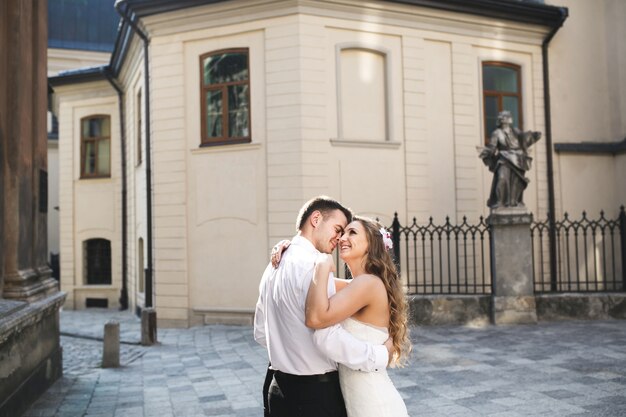 Young couple smiling while embracing