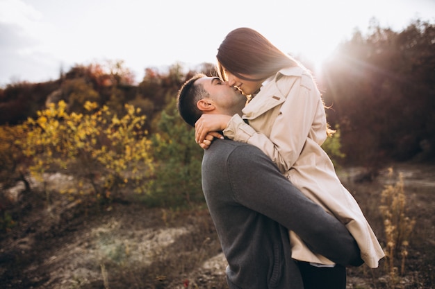 Free Photo young couple together in an autumn nature