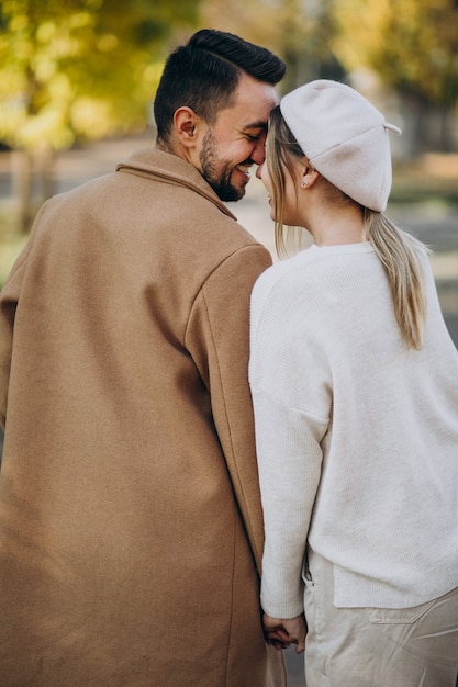 Free photo young couple together in an autumn park