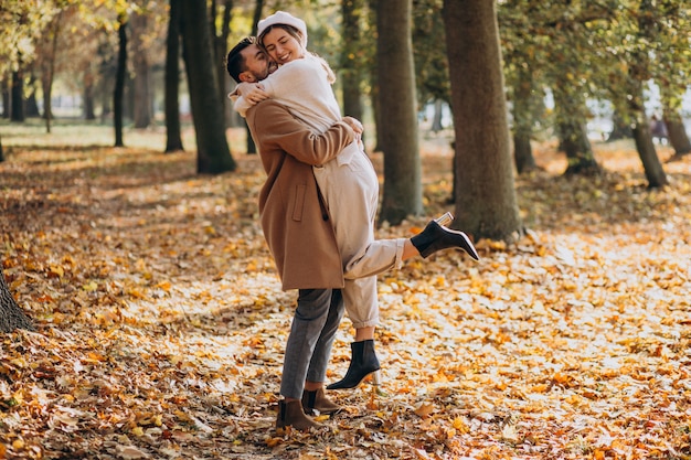 Free photo young couple together in an autumn park