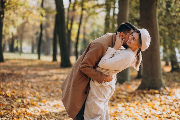 Free photo young couple together in an autumn park