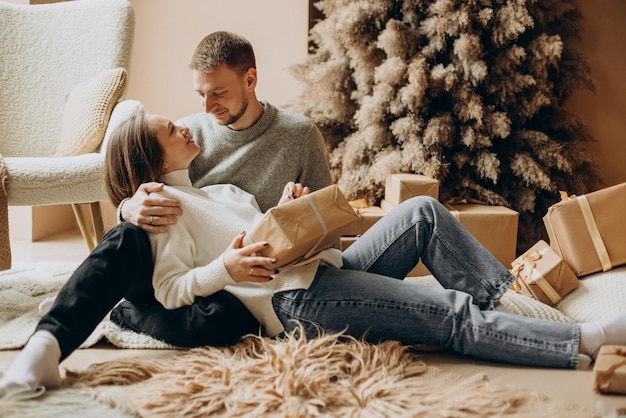 Free photo young couple together on the christmas eve