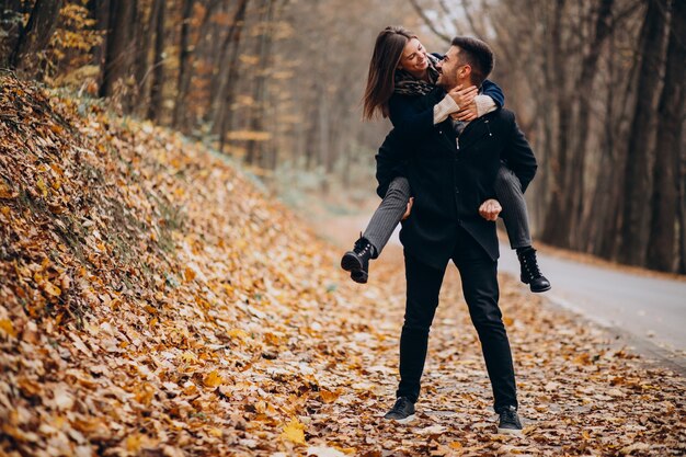 Young couple together walking in an autumn park