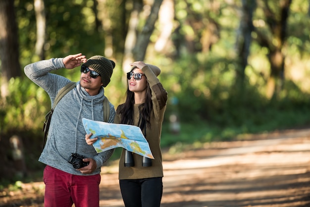 Free Photo young couple tourist travel in mountain forest