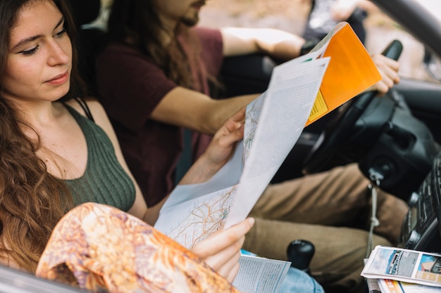 Young couple on a trip in a car