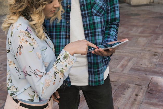 Free Photo young couple using smartphone