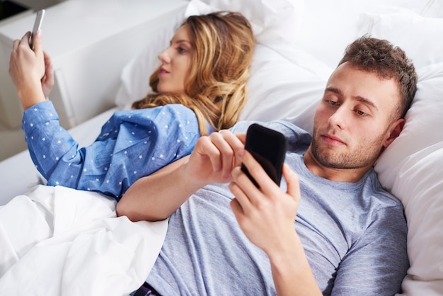 Young couple using wireless technology