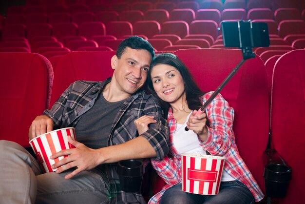 Young couple watching movie in cinema