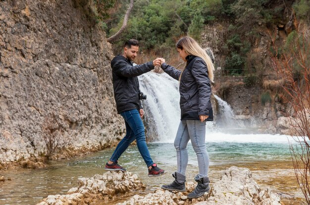 Young couple at waterfall