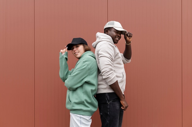 Young couple wearing trucker hat