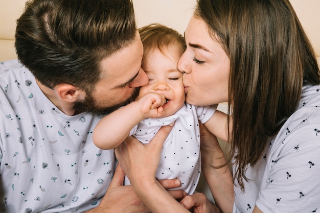 Young couple with baby in the morning