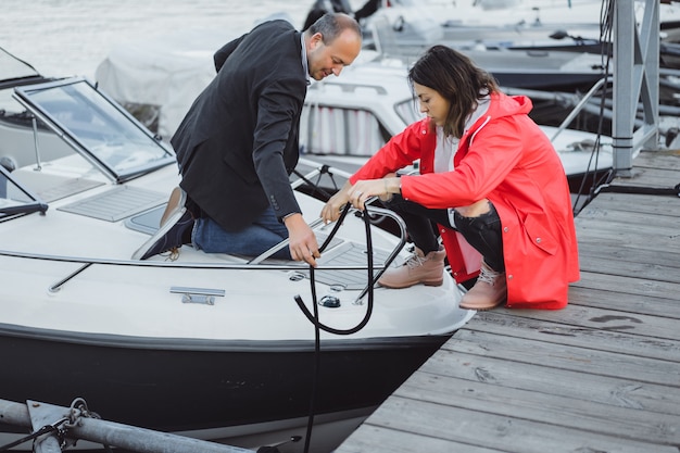 Free photo young couple in yachting port