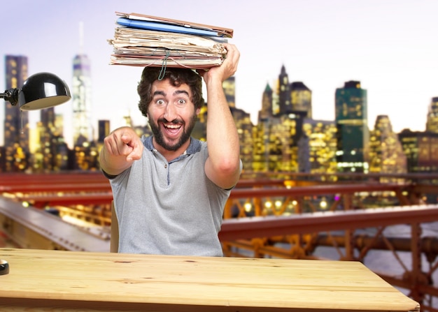 Free Photo young crazy man on a table surprised expression