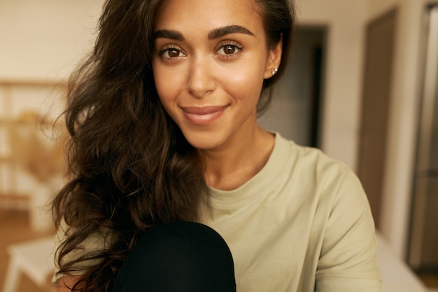 Young cute female posing indoor