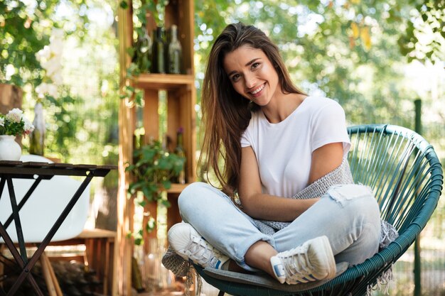 Young cute woman wrapped in a warm blanket